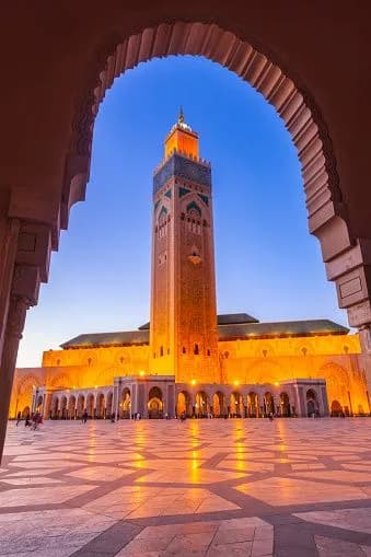 The Hassan II Mosque glowing at dusk, Casablanca