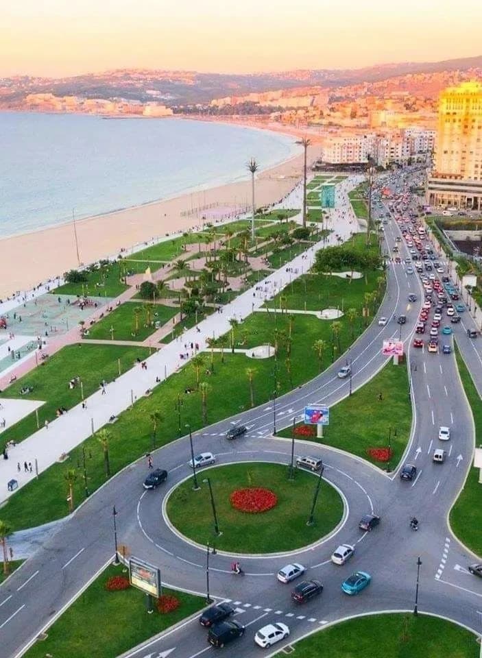 The palm-lined corniche and beach of Tangier from above