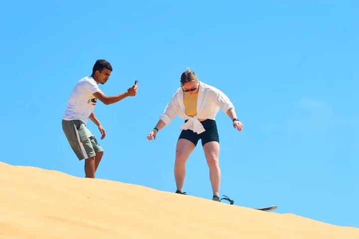 Sunset sandboarding with mint tea
