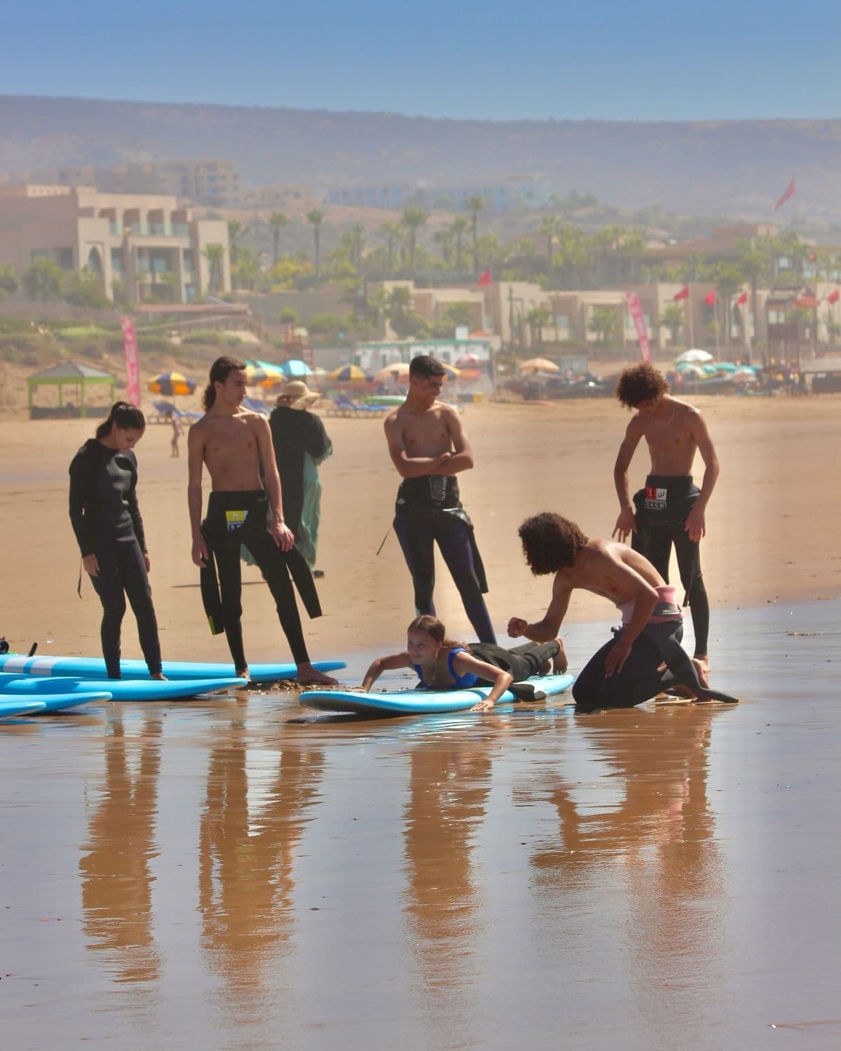 Beginner surfers with boards at a Taghazout beach